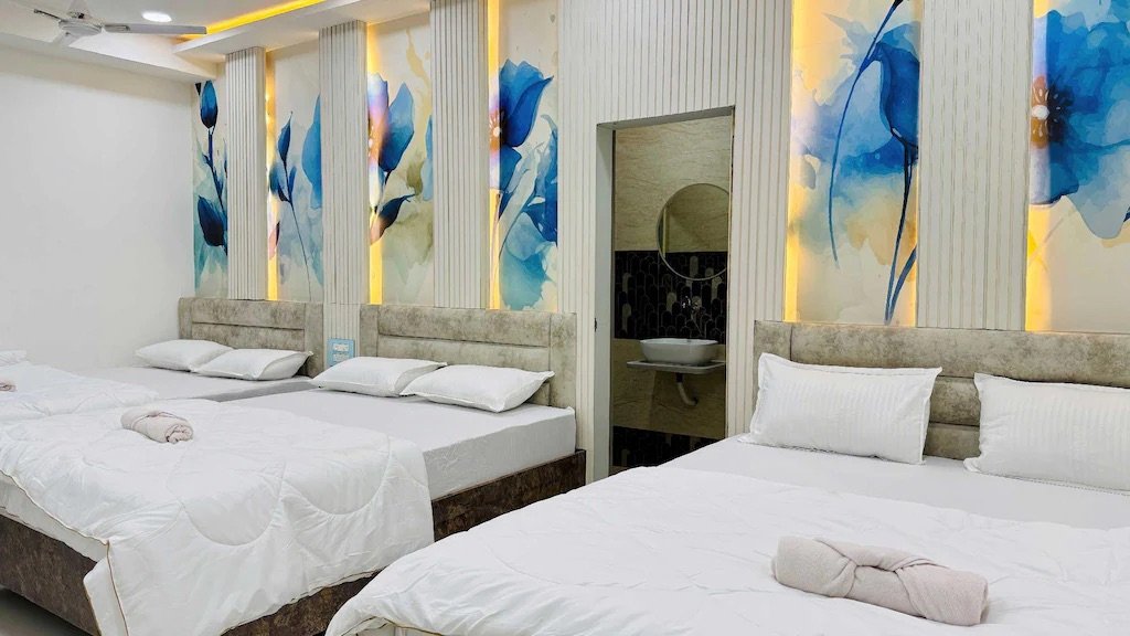 Hotel Om Mangalam Palace elegant corridor with Om-symbol ceiling lights